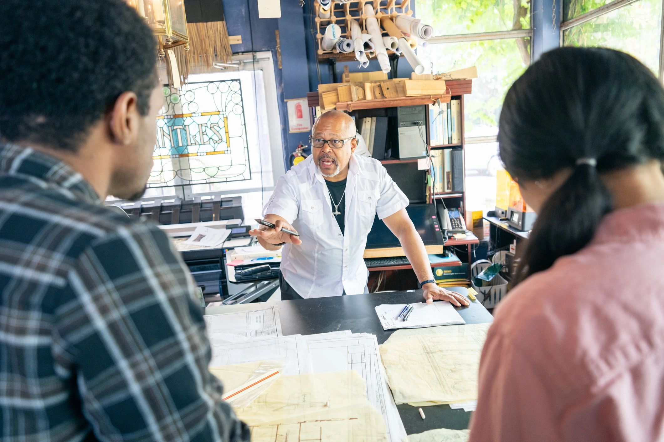 Team of architects working in the studio on a project